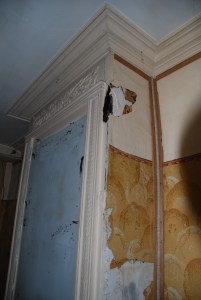 Lumps of plaster fell off, but the jazzy papers remain